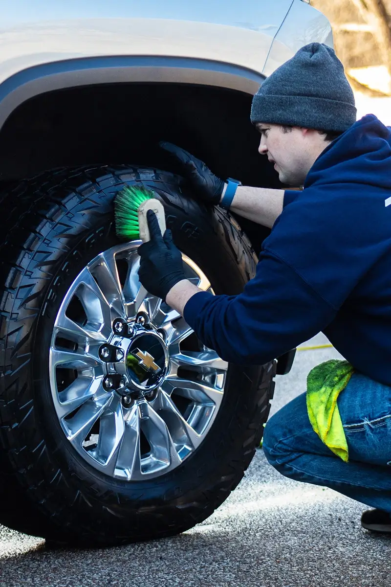 Dante cleaning wheels and tires