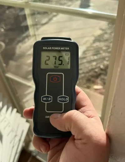A solar power meter reading 275.1 before window being tinted