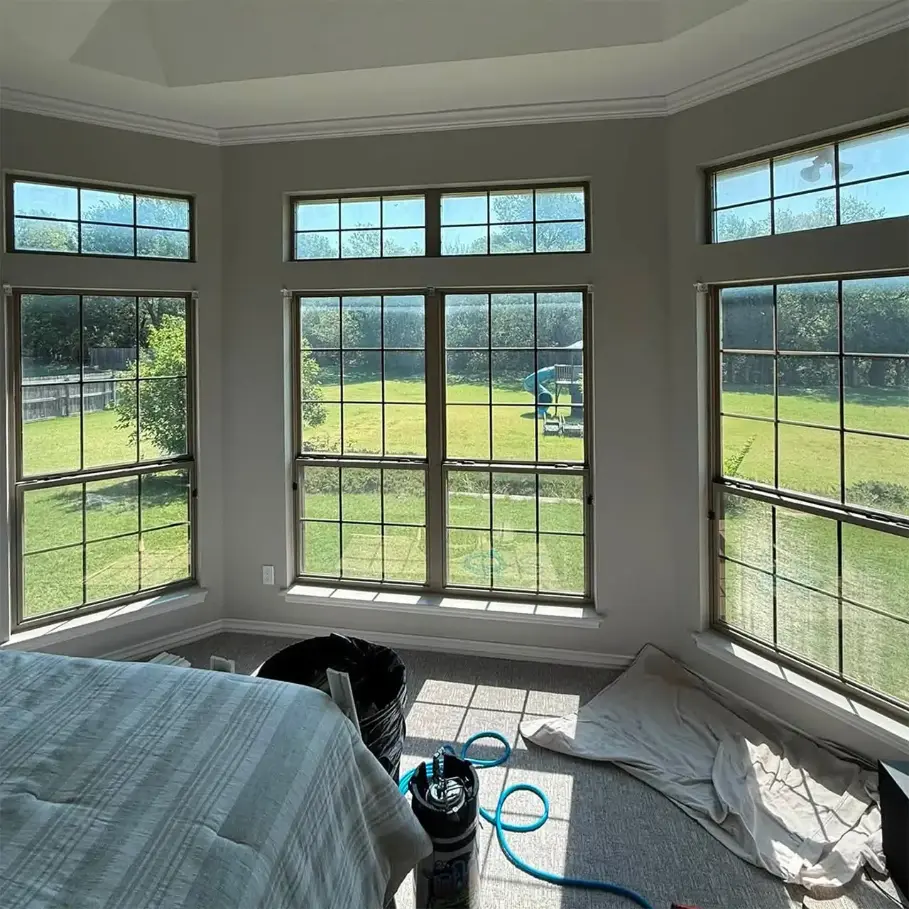 A large bedroom window after being tinted